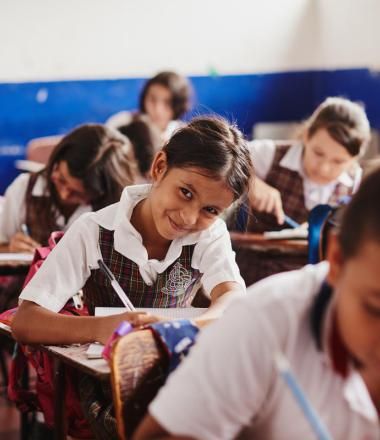 Children learn at desks in school in Colombia