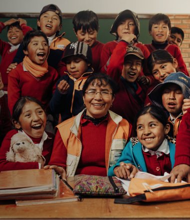 World Vision Staff Doris with children in classroom