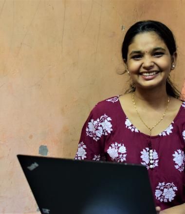 Sneha working from home using her computer