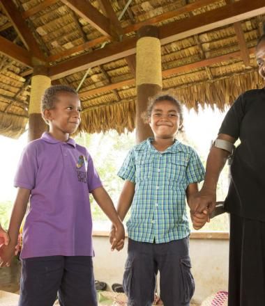 children and their teacher after a Sunday School session.