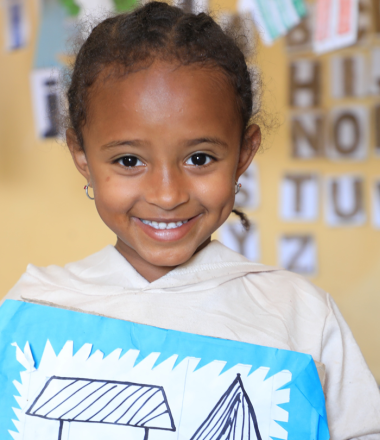 A child at ECD Center Smiling