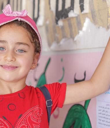 Syrian girl in a school hallway