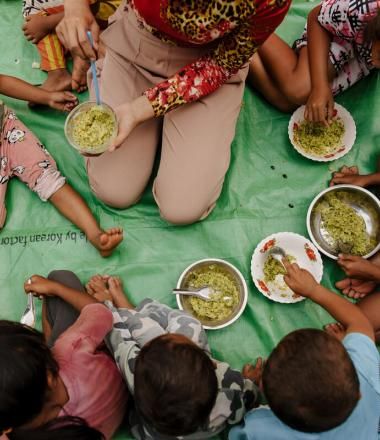 Group of children from Cambodia eating